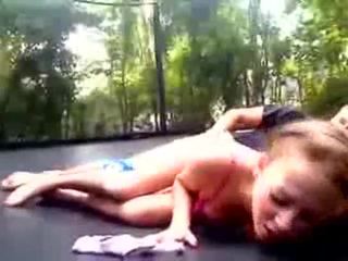 Shaved gf gets fucked on a trampoline outdoors